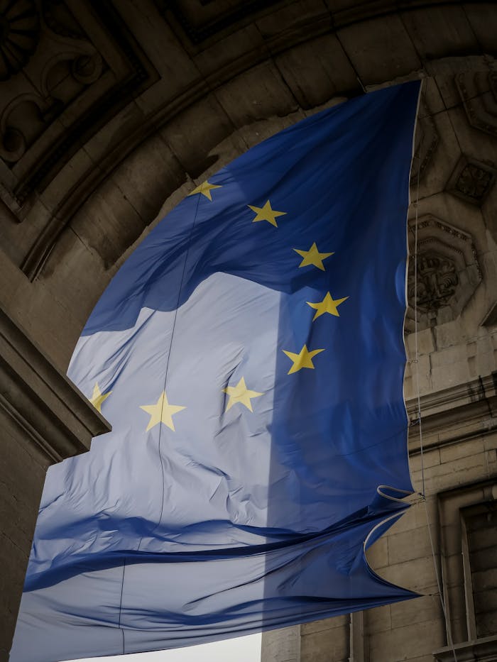 The european union flag is seen outside the eu headquarters in brussels